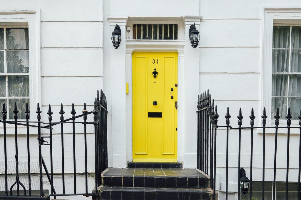 an old building with a yellow front door