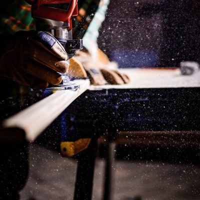 a builder cutting wood for a construction project